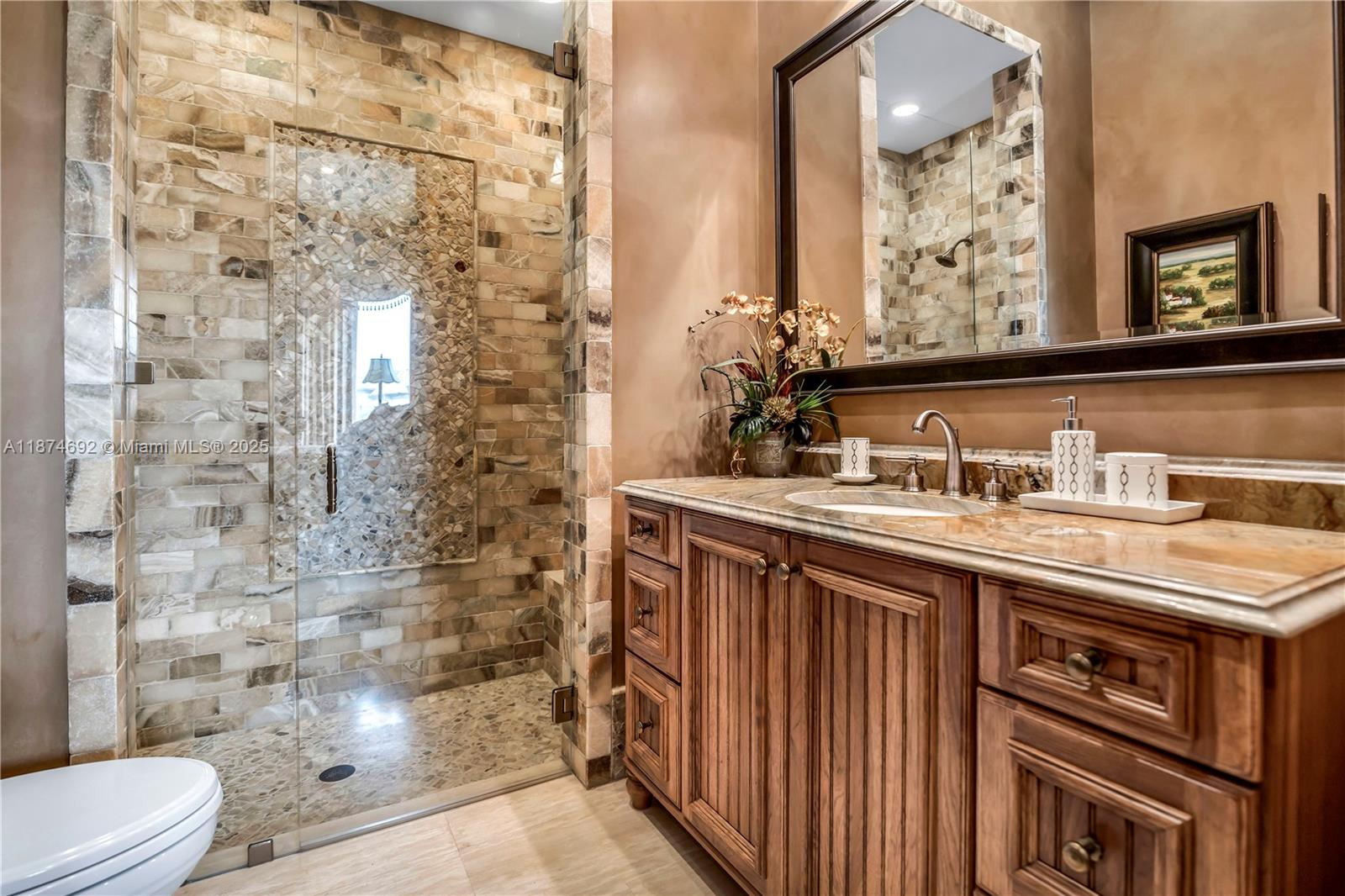 700 47th Street Boca Raton, FL 33431 - Photo 56 of 73 a bathroom with a sink a toilet and shower