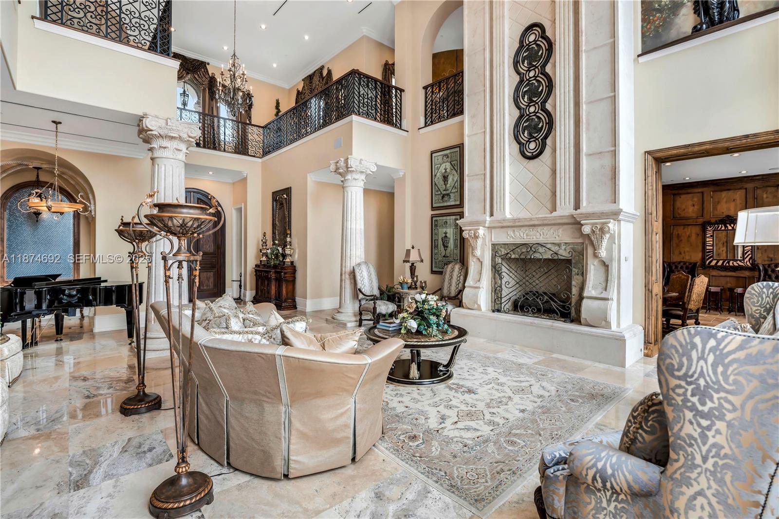 700 47th Street Boca Raton, FL 33431 - Photo 6 of 73 a living room with patio furniture and a fireplace