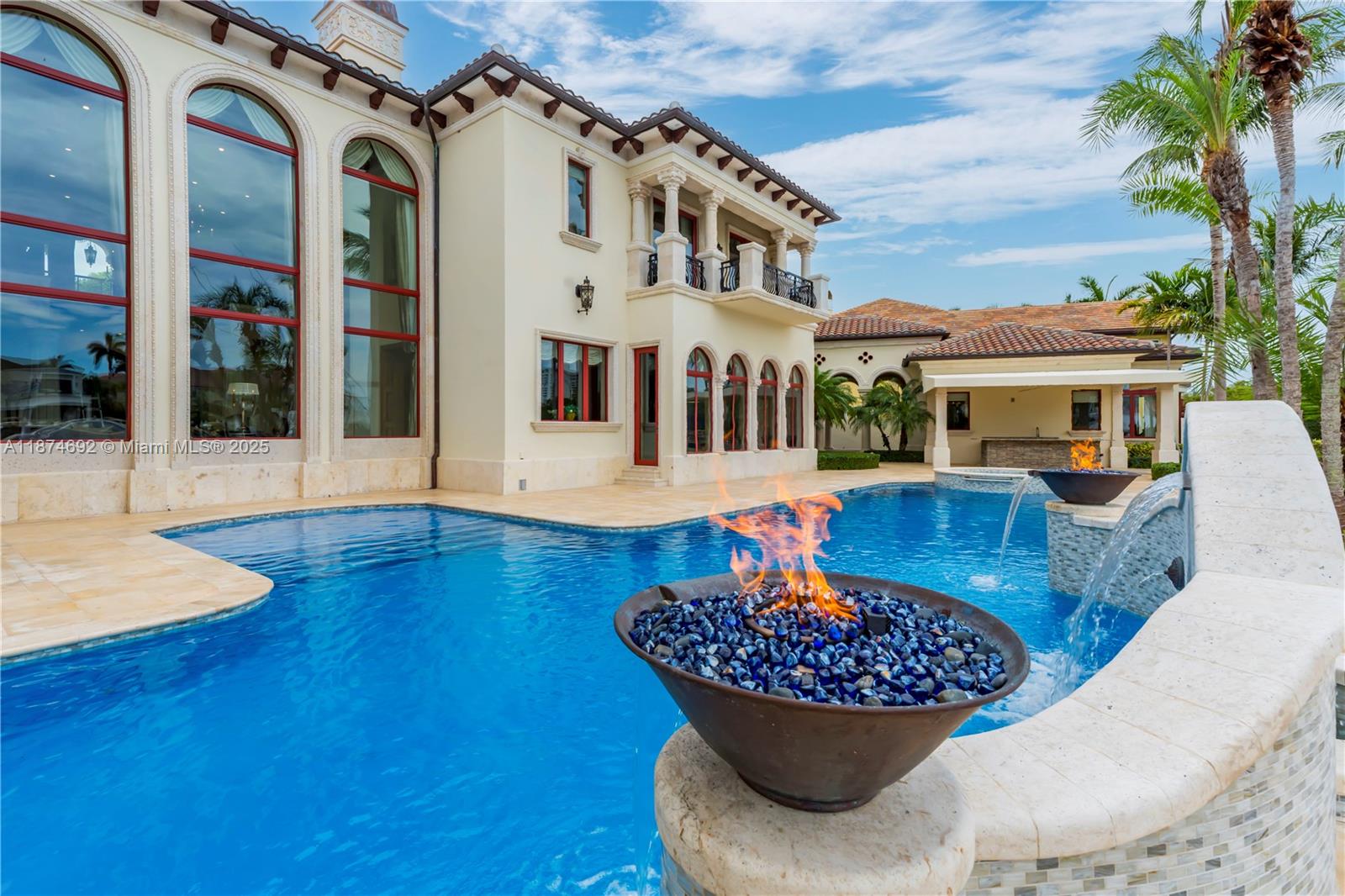 700 47th Street Boca Raton, FL 33431 - Photo 70 of 73 a view of a patio with couches table and chairs and potted plants