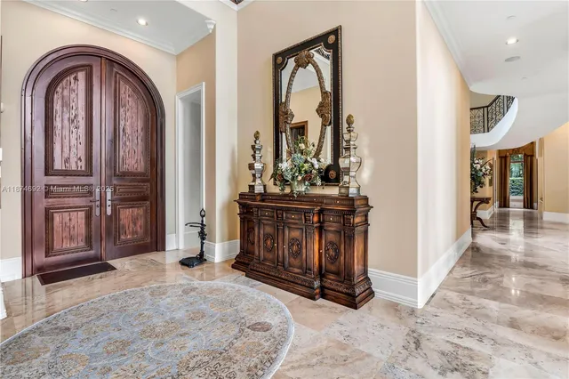 a bathroom with a granite countertop sink a toilet and a mirror