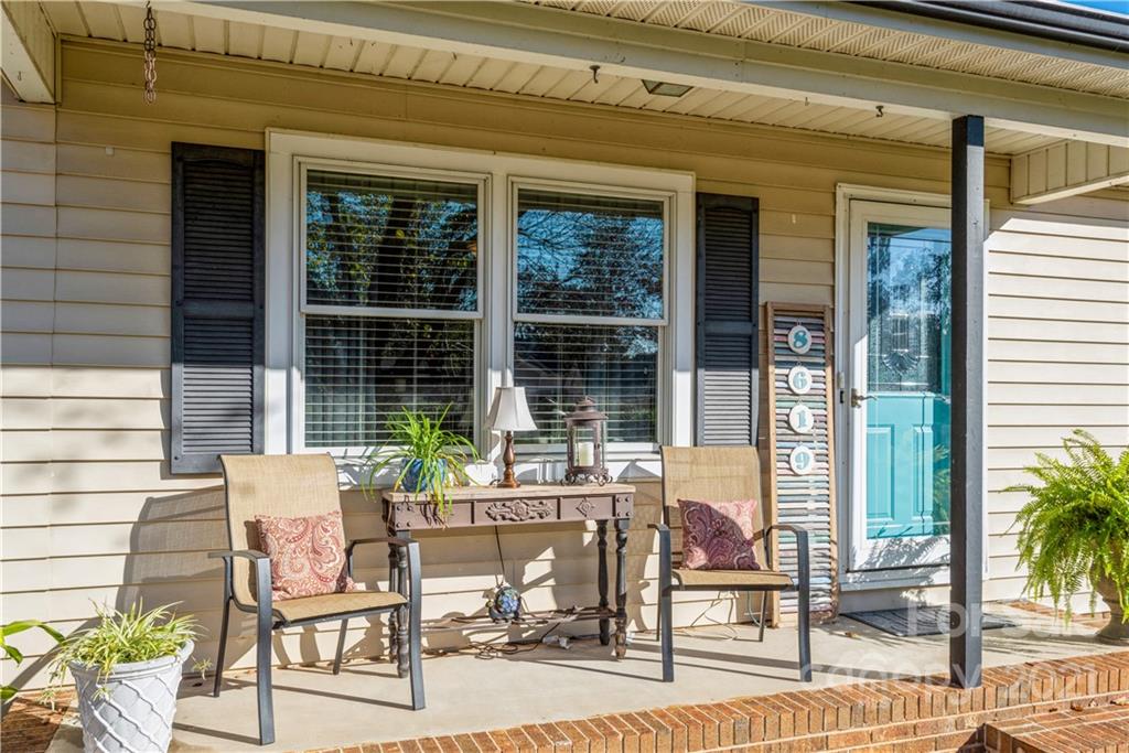 8619 Unity Church Road Denver, NC 28037 - Photo 2 of 24 a view of a patio with table and chairs and potted plants