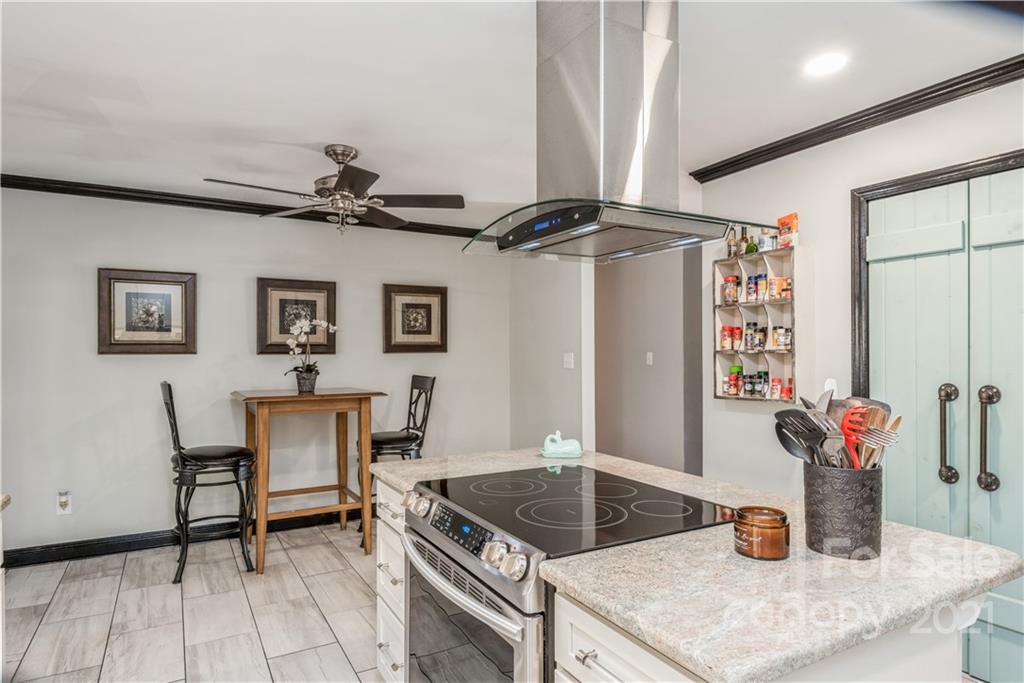 8619 Unity Church Road Denver, NC 28037 - Photo 11 of 24 a kitchen with a table and chairs
