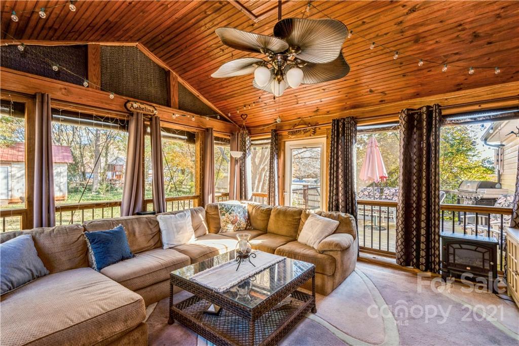 8619 Unity Church Road Denver, NC 28037 - Photo 13 of 24 a living room with furniture ceiling fan and a floor to ceiling window