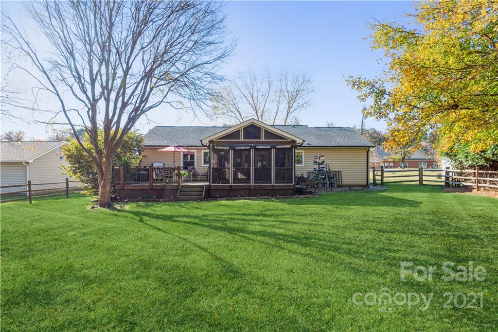8619 Unity Church Road Denver, NC 28037 - Photo 21 of 24 a front view of a house with garden