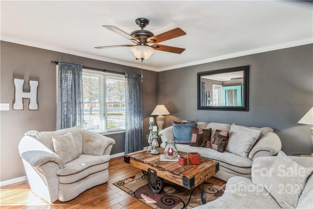 8619 Unity Church Road Denver, NC 28037 - Photo 4 of 24 a living room with furniture a ceiling fan and a window