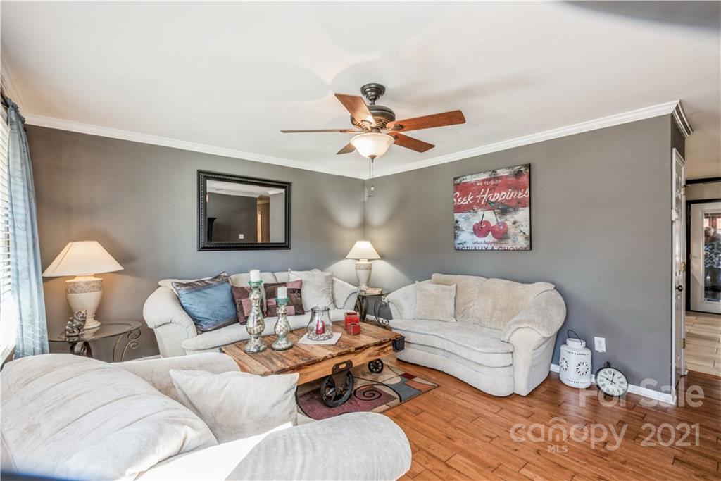 8619 Unity Church Road Denver, NC 28037 - Photo 5 of 24 a living room with furniture and a lamp