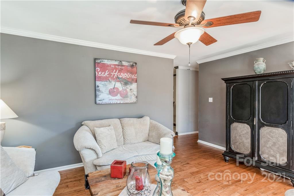 8619 Unity Church Road Denver, NC 28037 - Photo 6 of 24 a living room with furniture and a chandelier