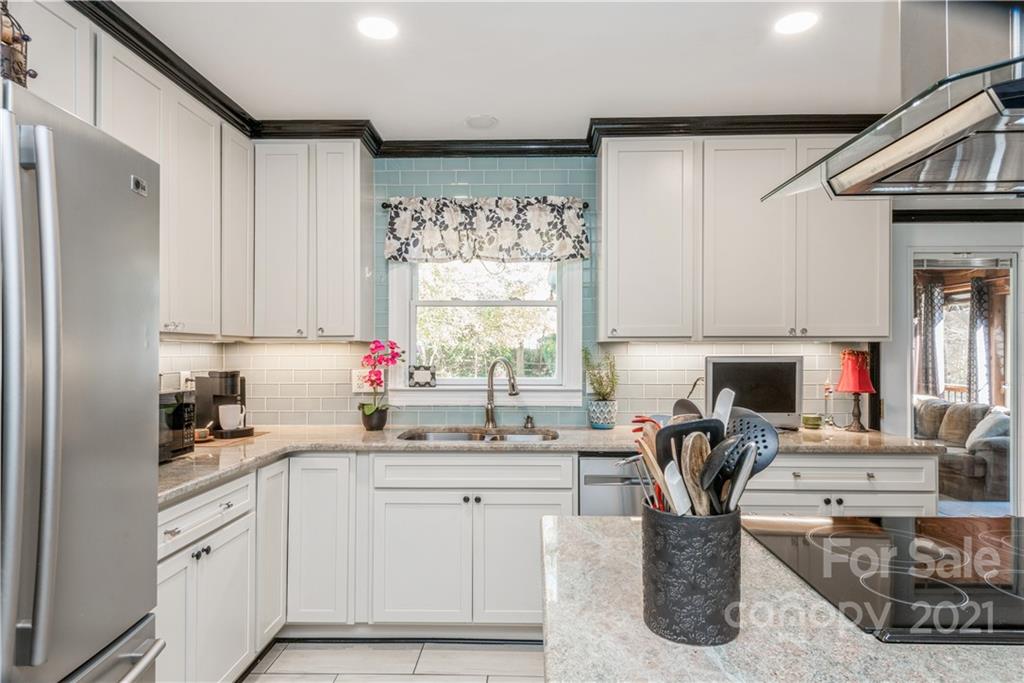 8619 Unity Church Road Denver, NC 28037 - Photo 10 of 24 a kitchen with a sink cabinets and window