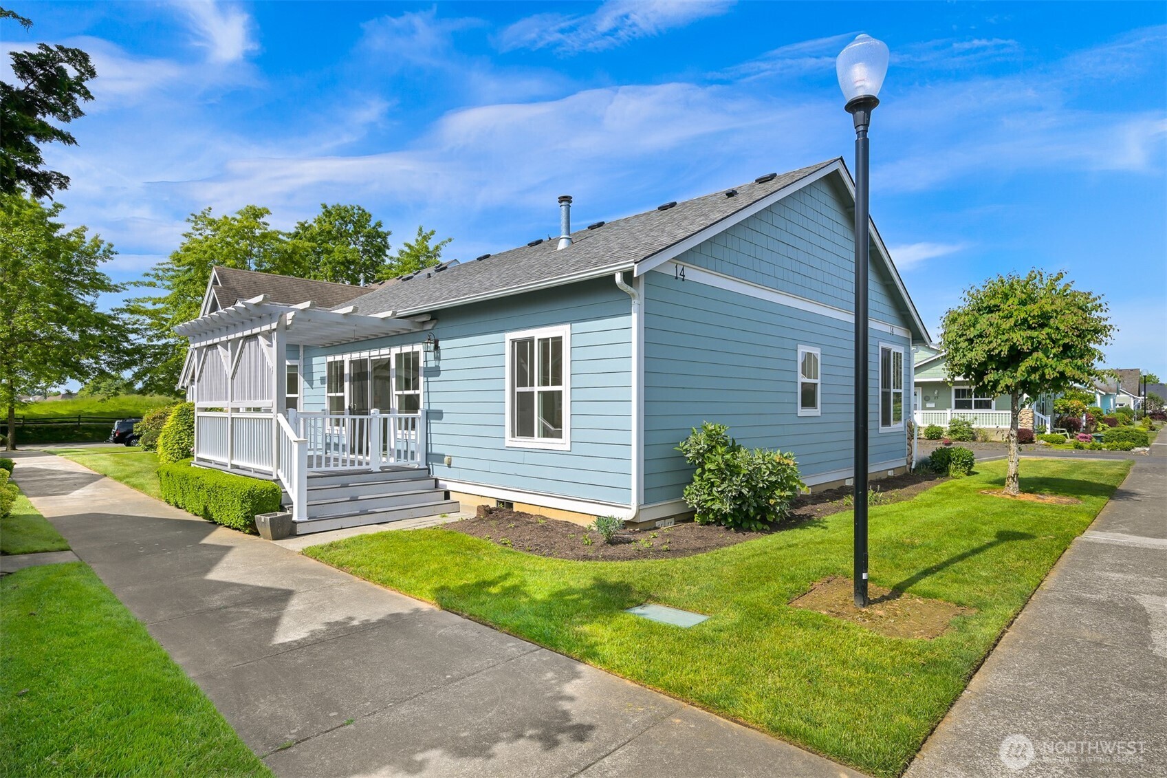500 Fieldstone Loop, Unit 14 Lynden, WA 98264 - Photo 23 of 25 a front view of a house with a yard