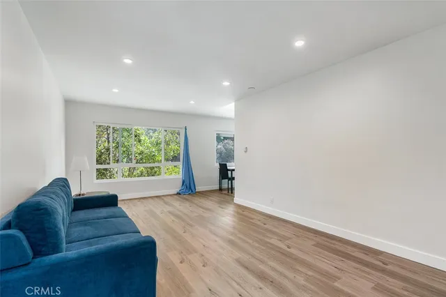 a view of a livingroom with furniture and wooden floor