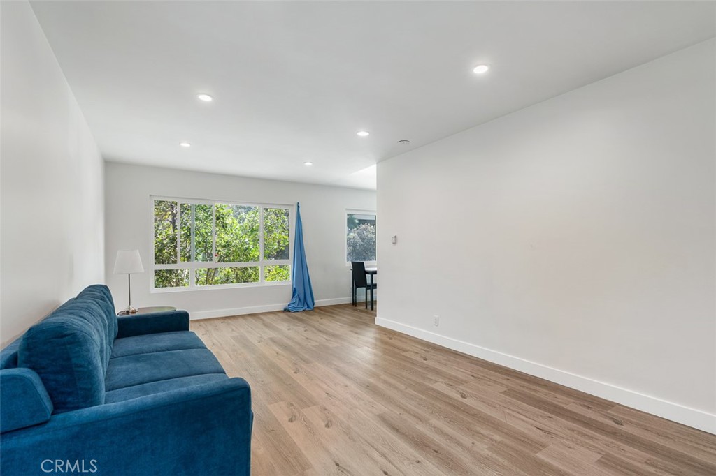 259 North Euclid Avenue Pasadena, CA 91101 - Photo 11 of 33 a living room with furniture and a large window