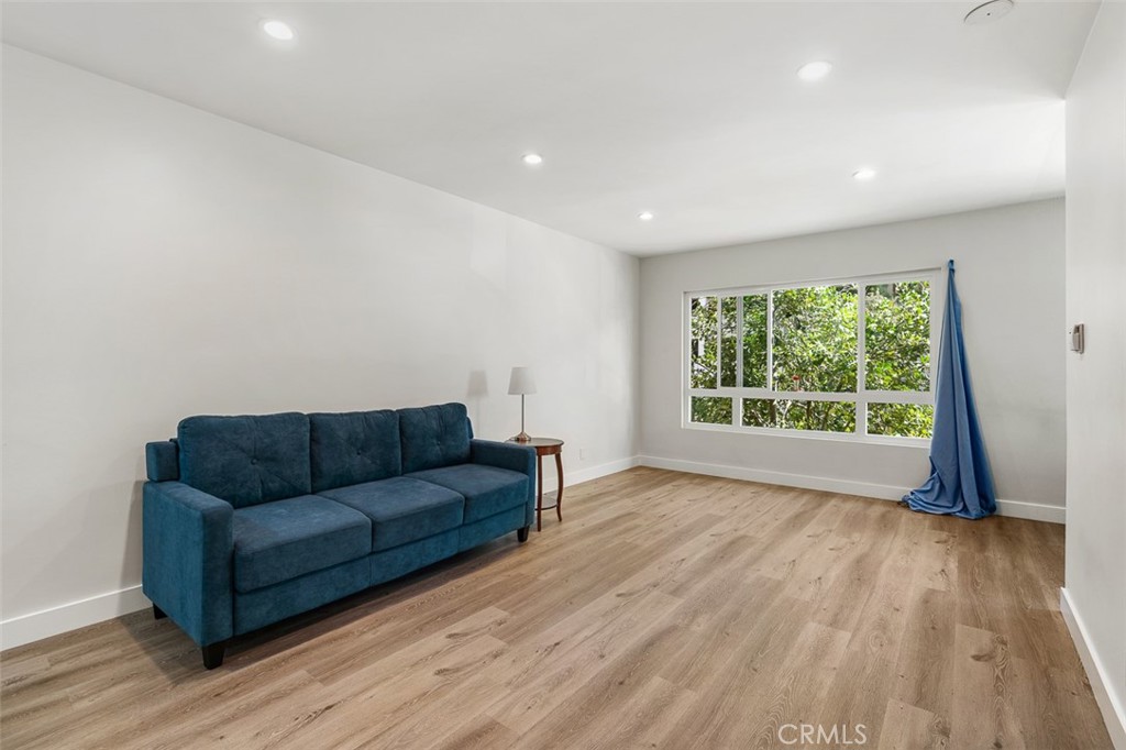 259 North Euclid Avenue Pasadena, CA 91101 - Photo 12 of 33 a living room with couch and a large window