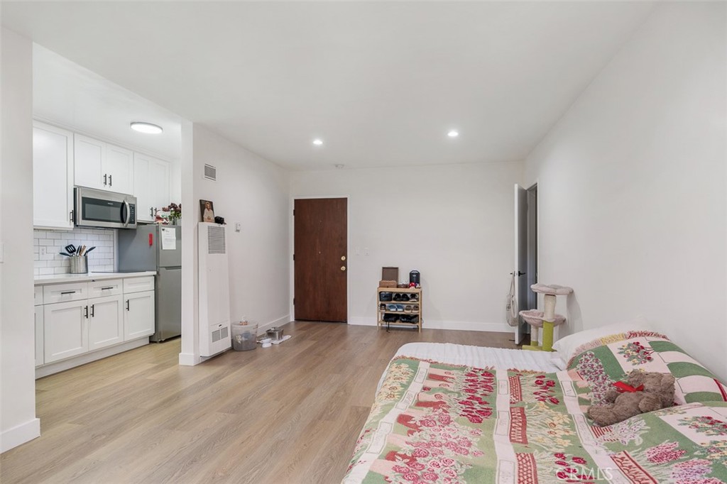 259 North Euclid Avenue Pasadena, CA 91101 - Photo 20 of 33 a open kitchen with stainless steel appliances granite countertop a refrigerator and a stove top oven