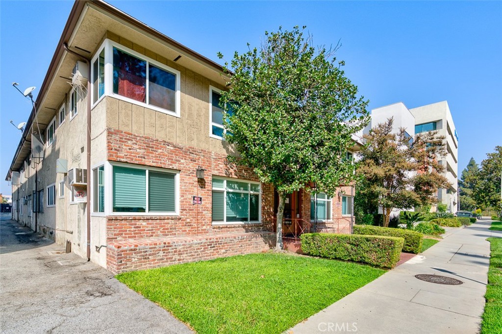 259 North Euclid Avenue Pasadena, CA 91101 - Photo 9 of 33 a front view of a house with a yard and trees