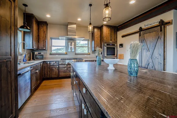 a large bed sitting in a bedroom next to a bathroom