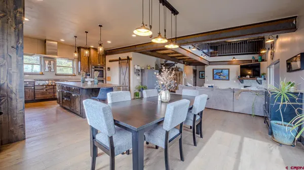a view of a kitchen with wooden floor