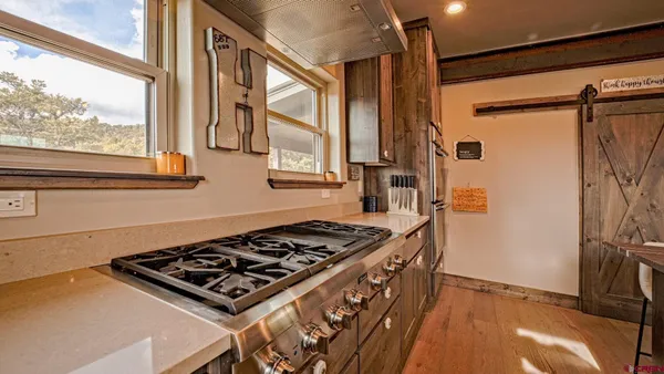 a room with cabinets and wooden floor