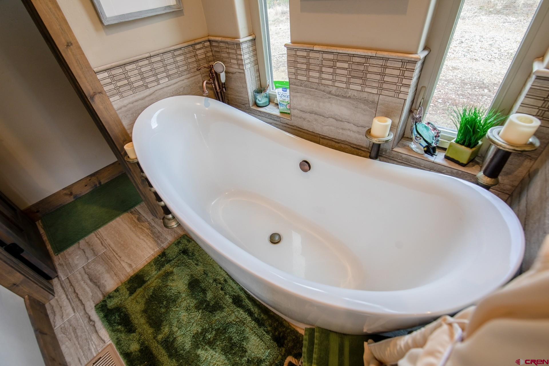 492 Fox Fire Ridge Road Bayfield, CO 81122 - Photo 23 of 44 a bathroom with a bathtub and sink