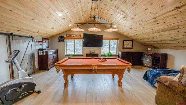 a kitchen with stainless steel appliances wooden cabinets granite counter tops and a stove