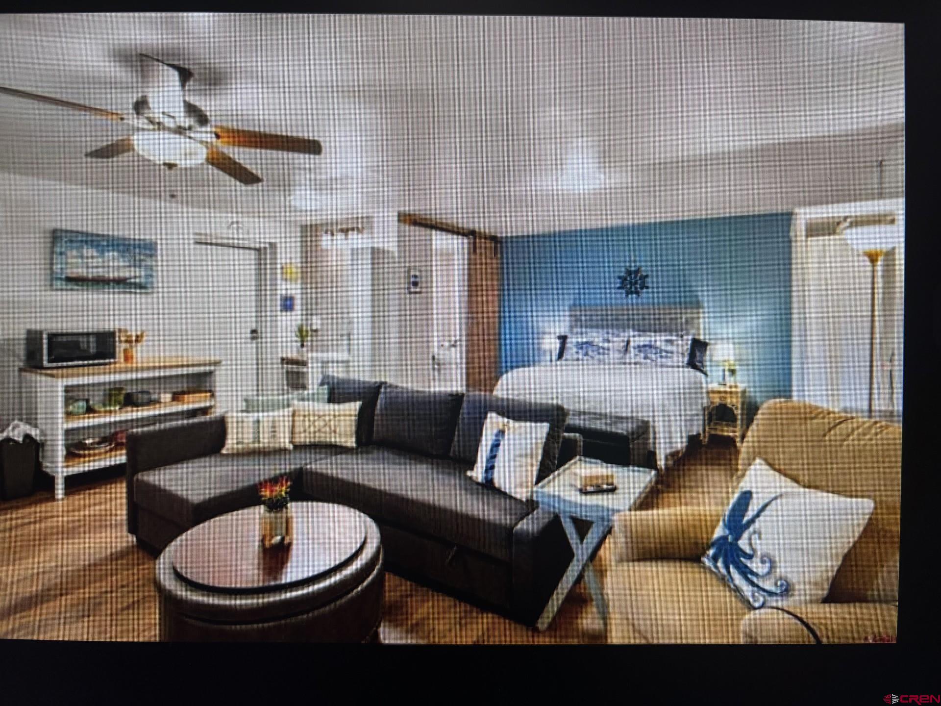 492 Fox Fire Ridge Road Bayfield, CO 81122 - Photo 39 of 44 a living room with furniture and a wooden floor
