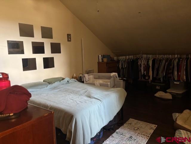 492 Fox Fire Ridge Road Bayfield, CO 81122 - Photo 43 of 44 a bedroom with a bed and a potted plant