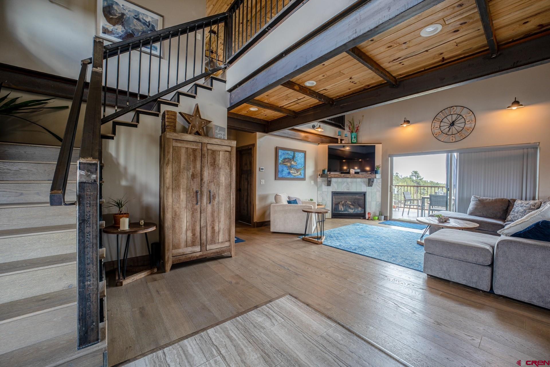 492 Fox Fire Ridge Road Bayfield, CO 81122 - Photo 6 of 44 a living room with furniture and a fireplace
