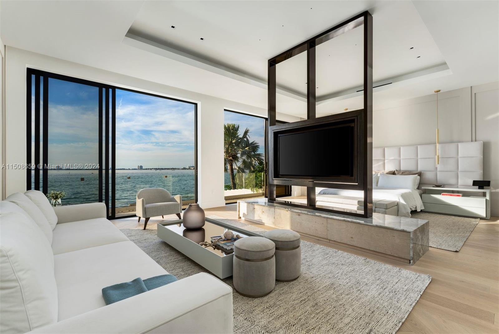 5310 North Bay Road Miami Beach, FL 33140 - Photo 25 of 35 a living room with furniture and a flat screen tv