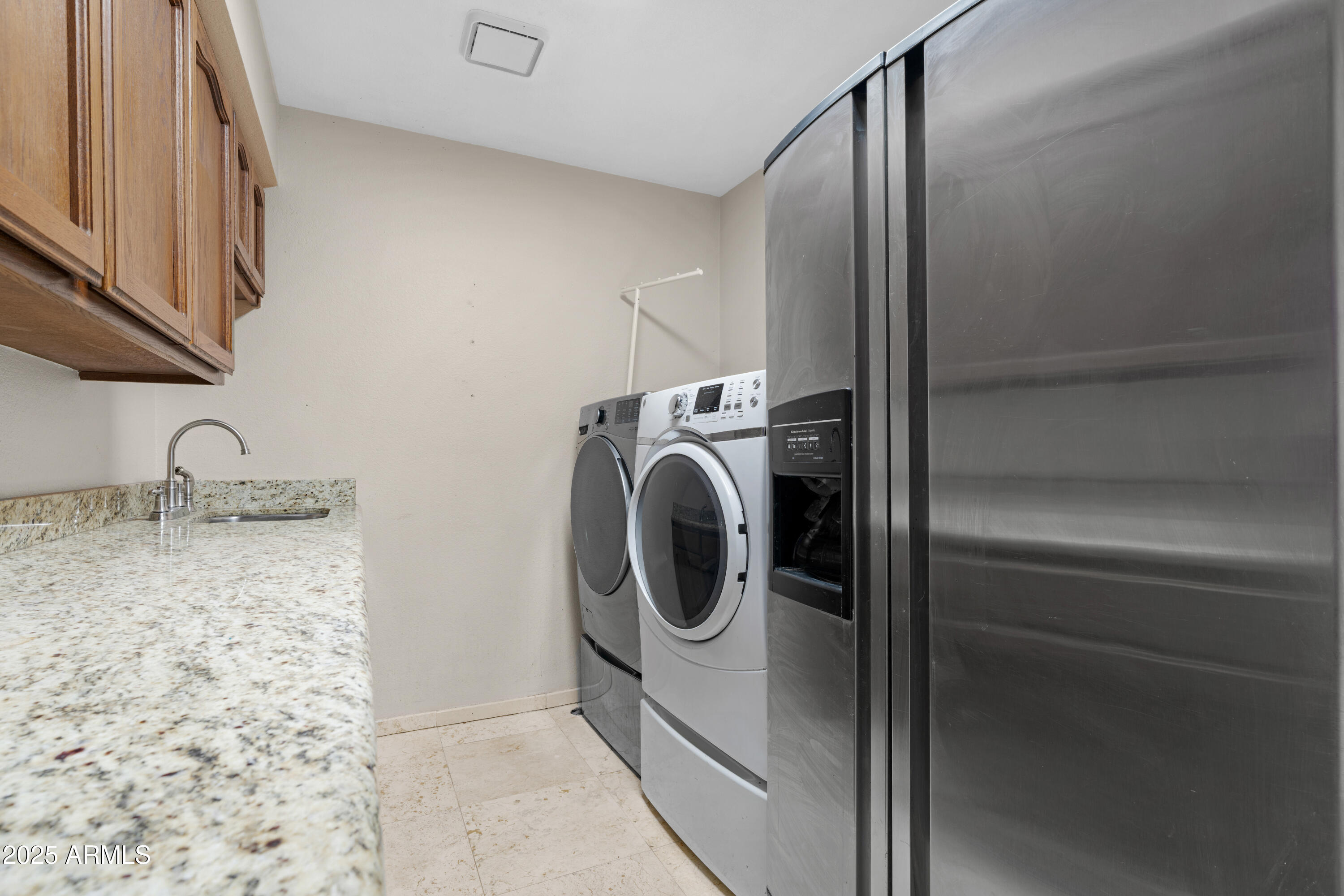 3152 East Irwin Avenue Mesa, AZ 85204 - Photo 11 of 39 a utility room with sink dryer and washer