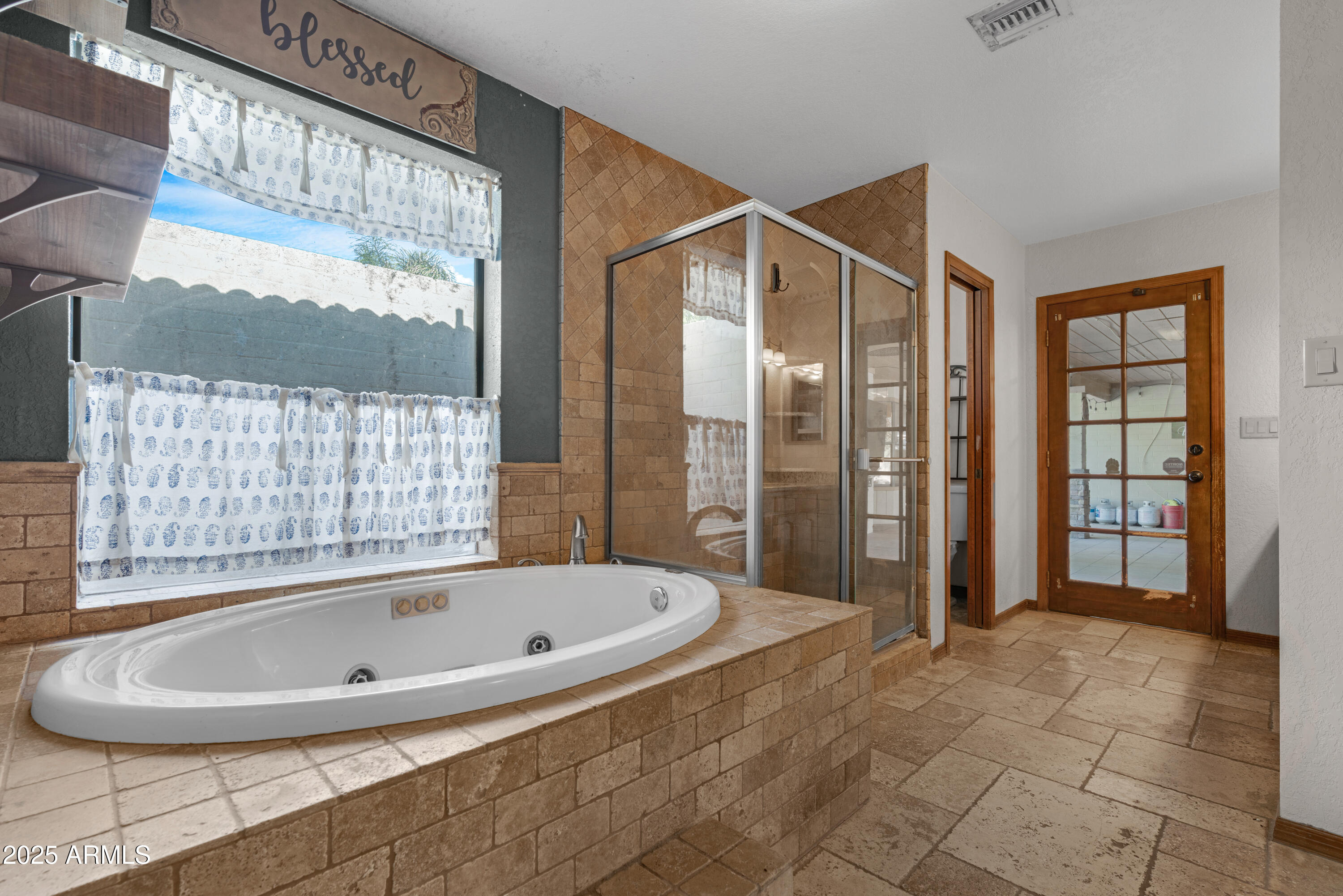 3152 East Irwin Avenue Mesa, AZ 85204 - Photo 13 of 39 a bathroom with shower and a bathtub