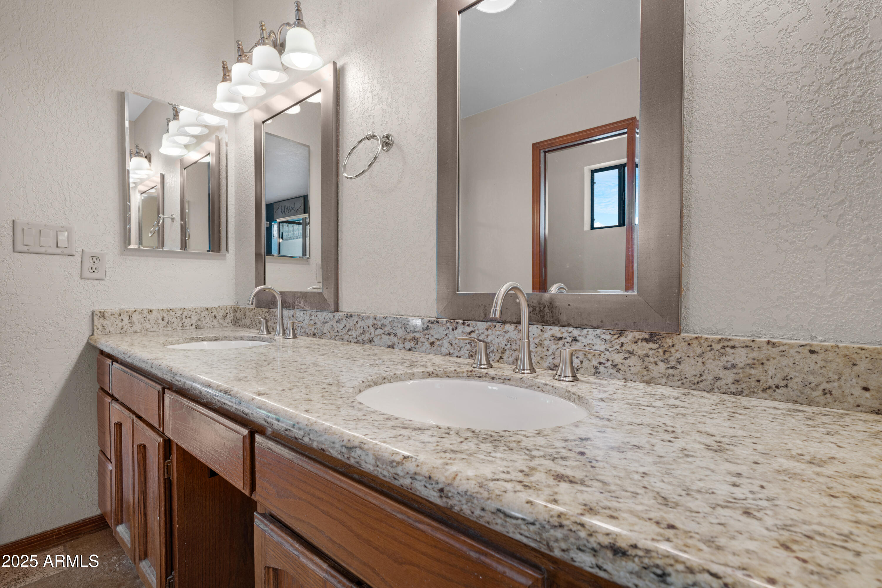 3152 East Irwin Avenue Mesa, AZ 85204 - Photo 14 of 39 a bathroom with a granite countertop sink and a mirror
