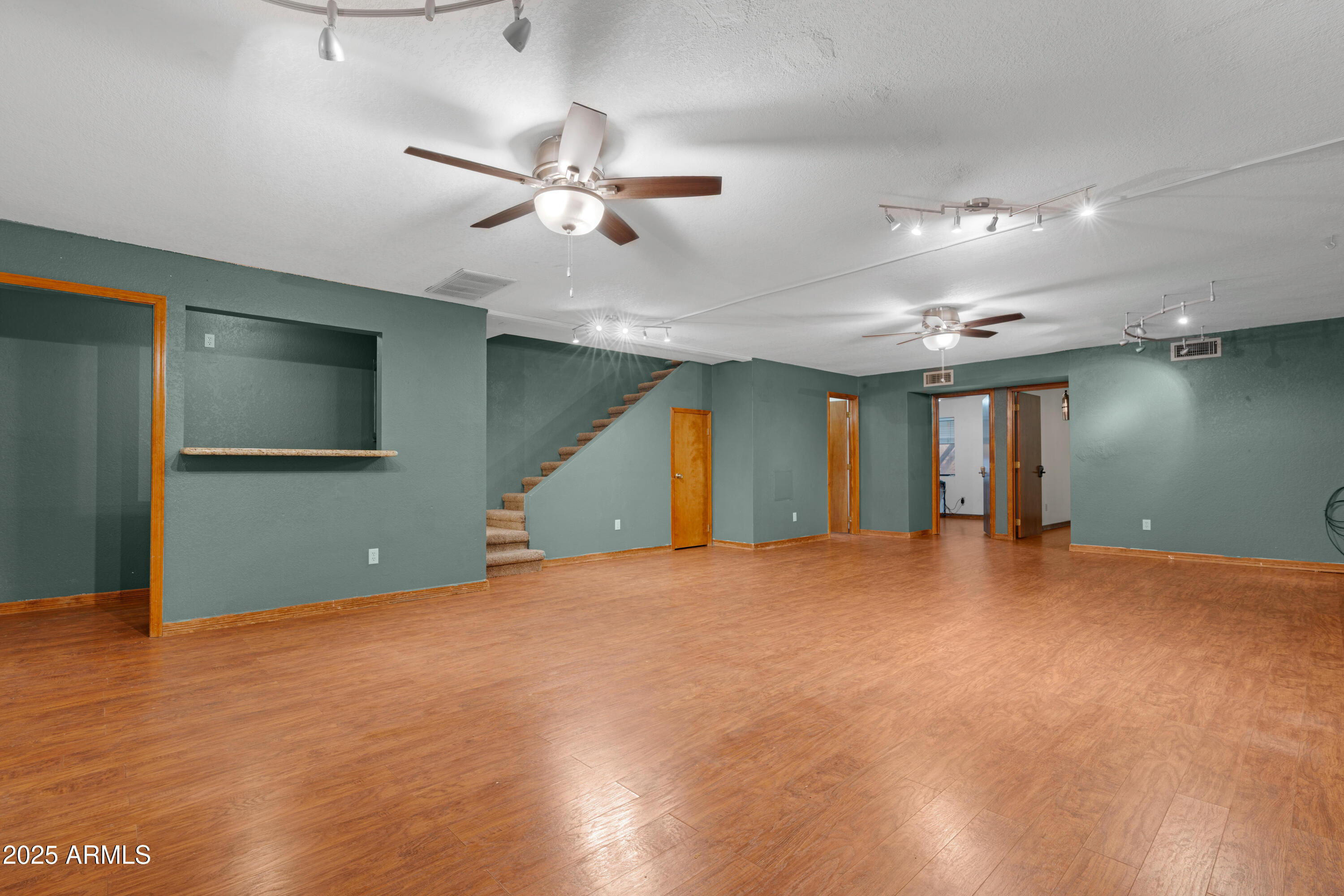 3152 East Irwin Avenue Mesa, AZ 85204 - Photo 16 of 39 a view of an empty room with a chandelier fan