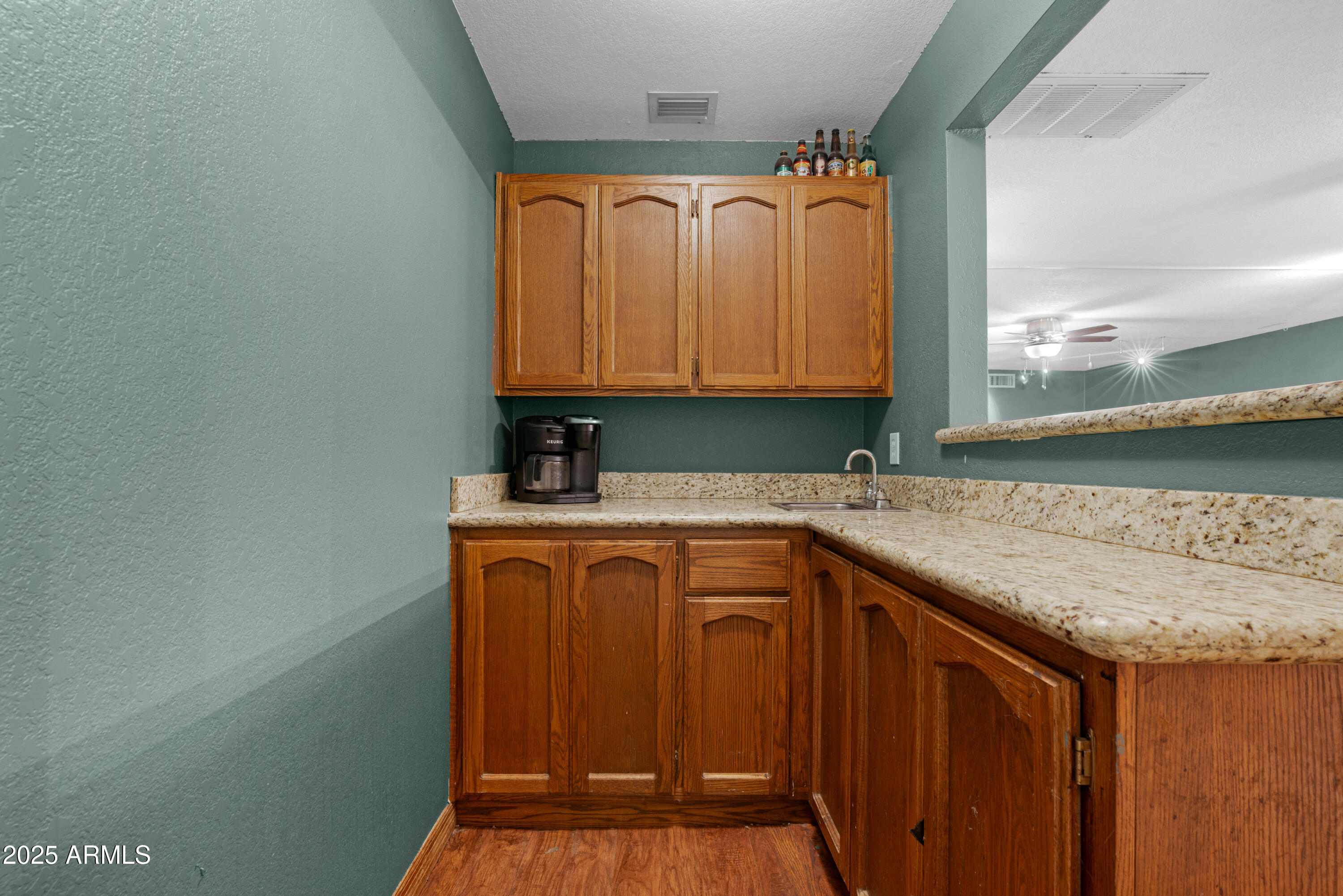 3152 East Irwin Avenue Mesa, AZ 85204 - Photo 18 of 39 a utility room with granite countertop a sink and a vanity
