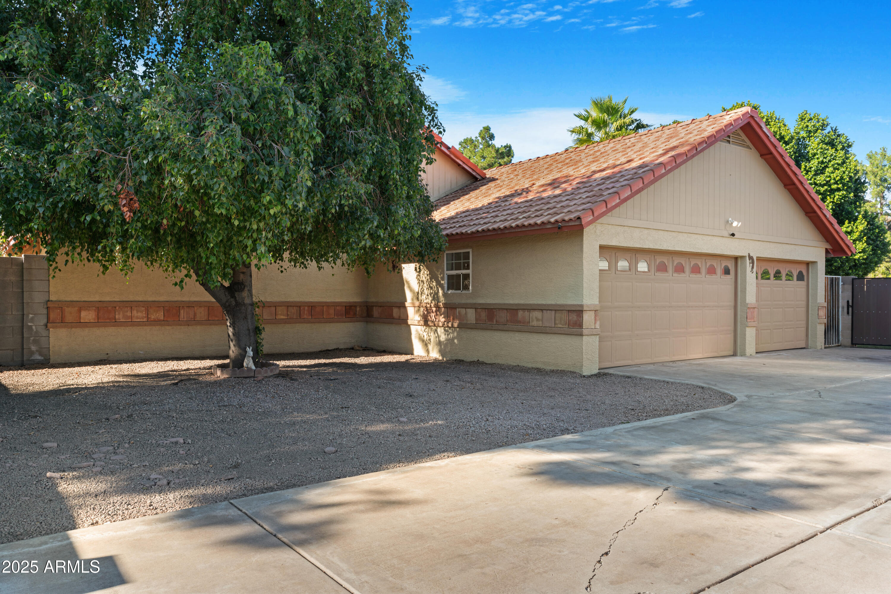 3152 East Irwin Avenue Mesa, AZ 85204 - Photo 19 of 39 a front view of a house with a garage