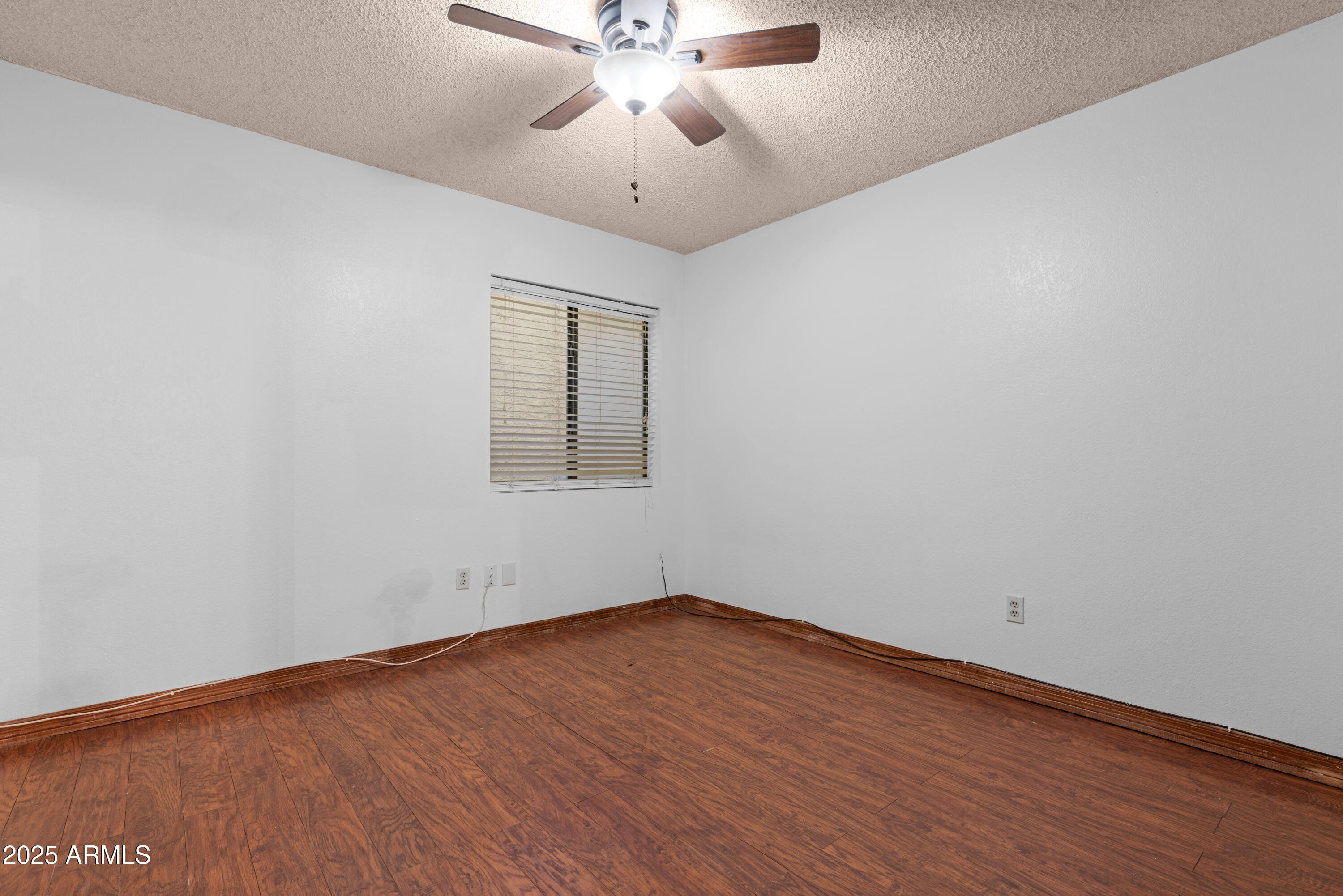 3152 East Irwin Avenue Mesa, AZ 85204 - Photo 23 of 39 wooden floor in an empty room with a window