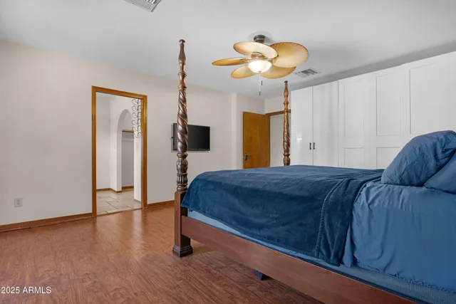 a bathroom with a granite countertop sink a toilet and bathtub