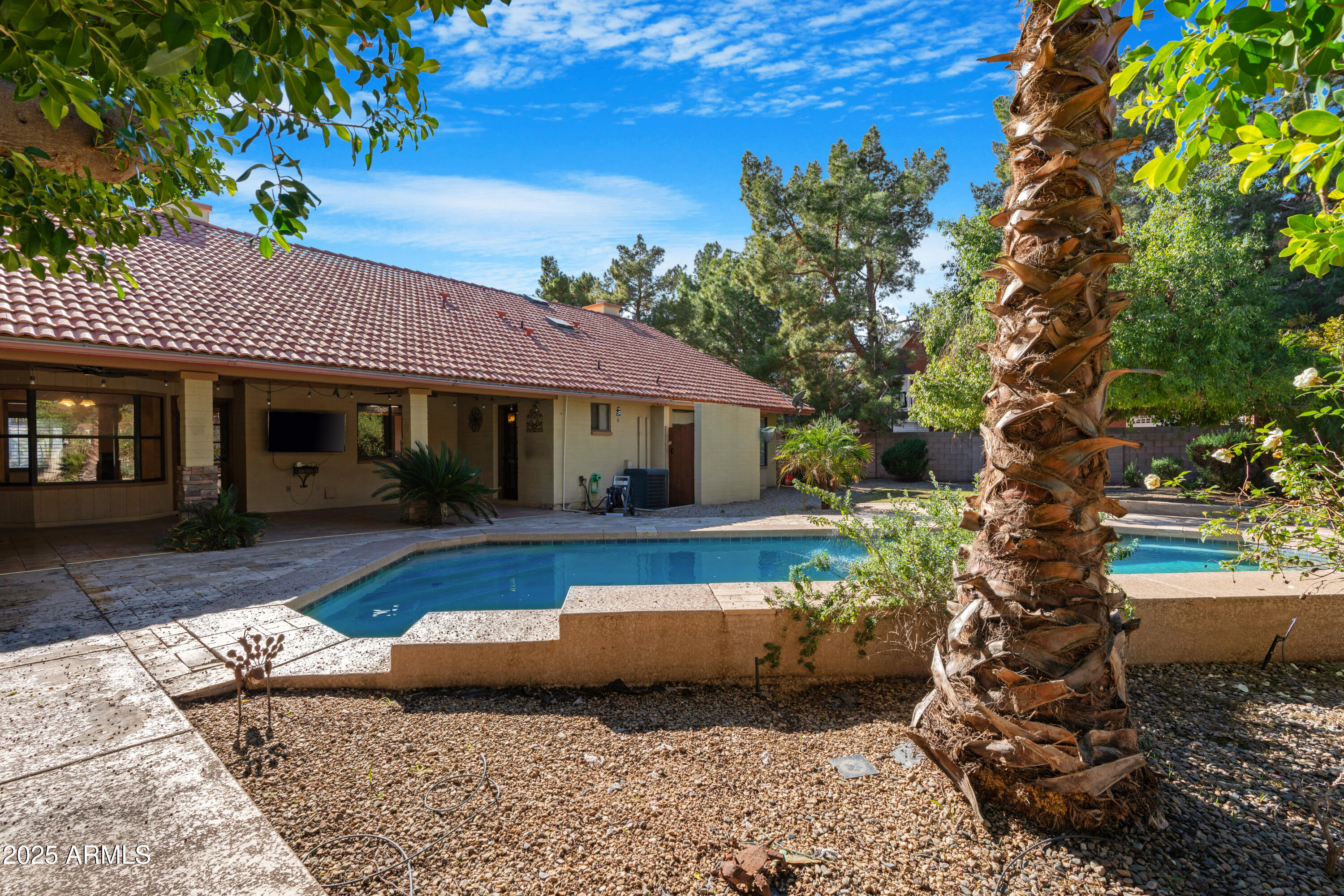 3152 East Irwin Avenue Mesa, AZ 85204 - Photo 31 of 39 a front view of a house with garden