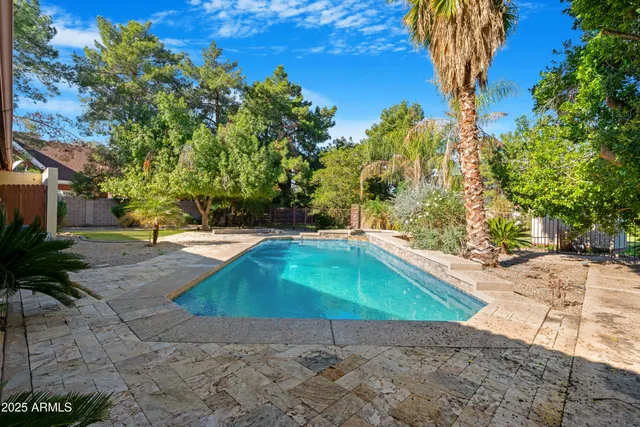 a view of outdoor space with garden and trees