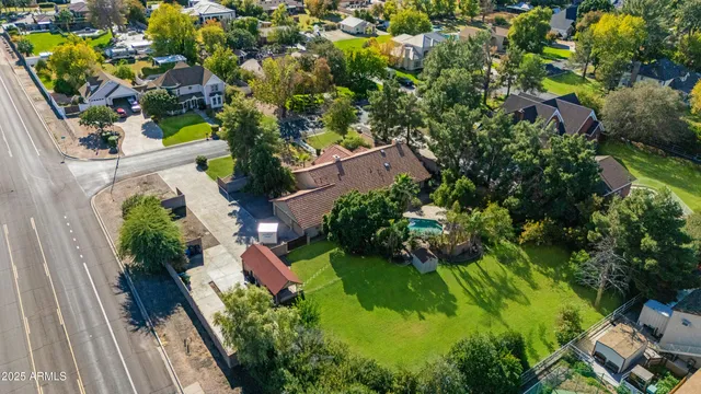 a view of a field with trees in the background