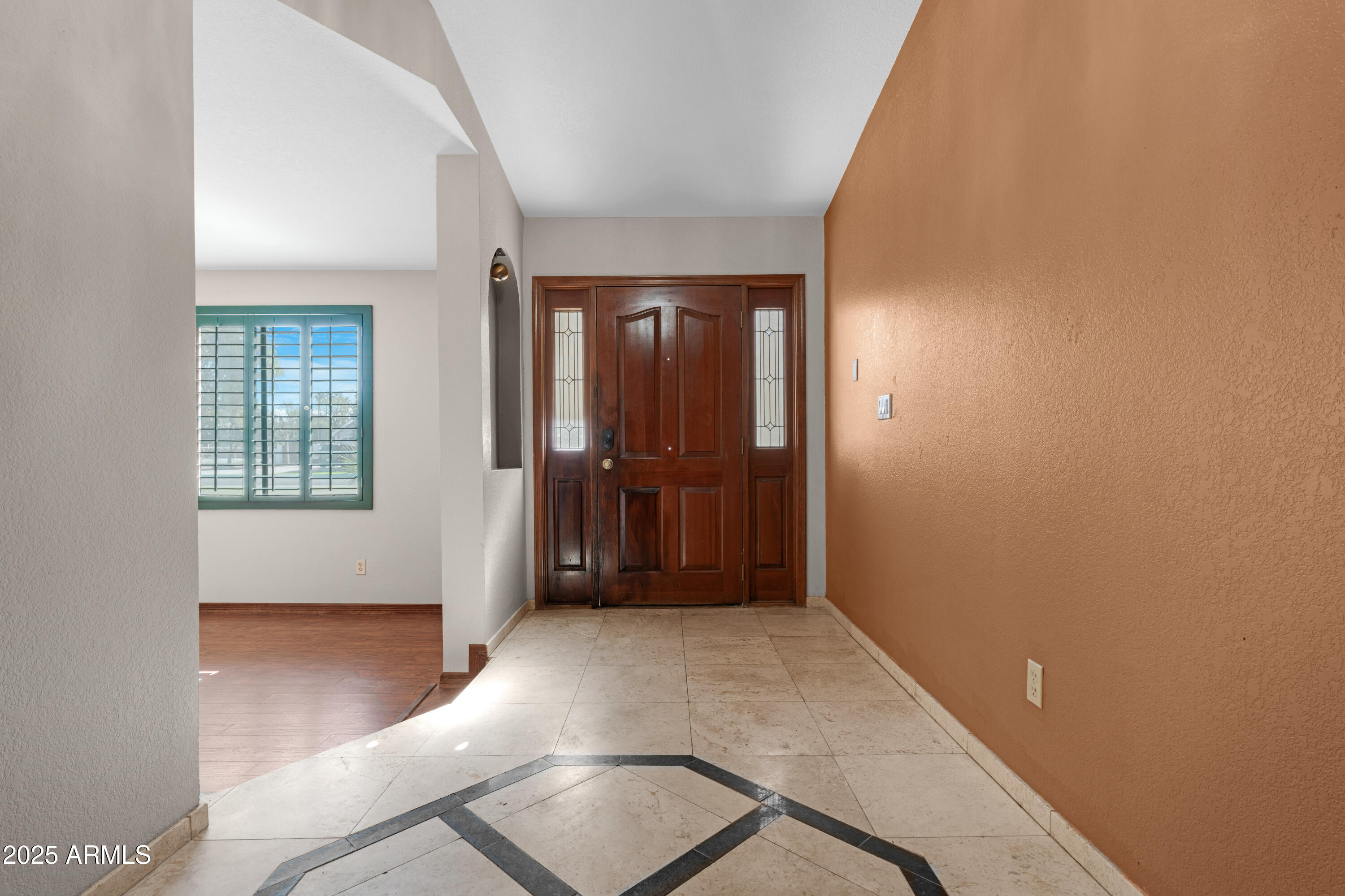 3152 East Irwin Avenue Mesa, AZ 85204 - Photo 6 of 39 an entryway with wooden floor and windows