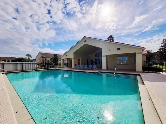 a view of a park with swings and slides