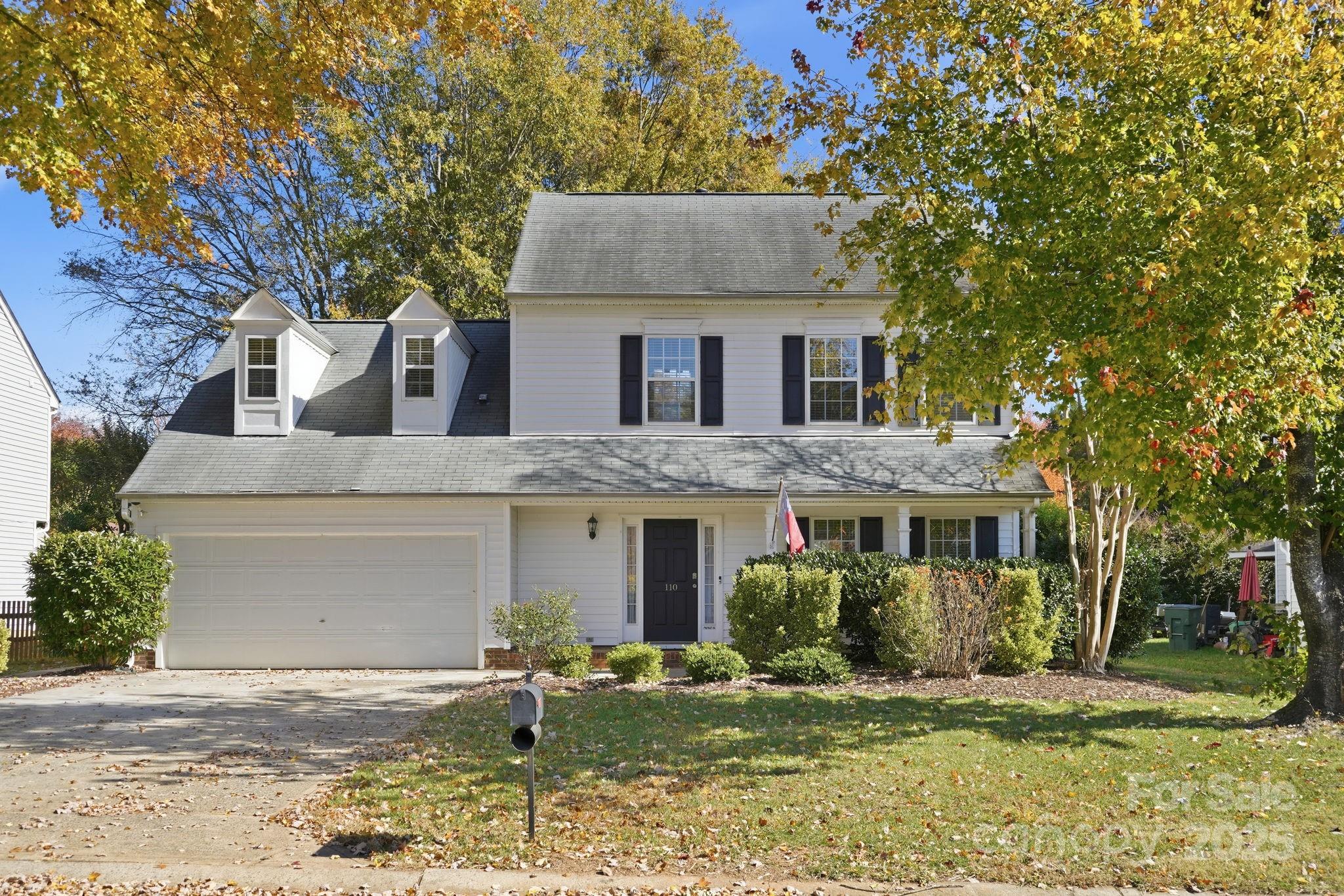 110 Nahcotta Drive Mooresville, NC 28115 - Photo 1 of 29 a front view of a house with a yard garage and outdoor seating