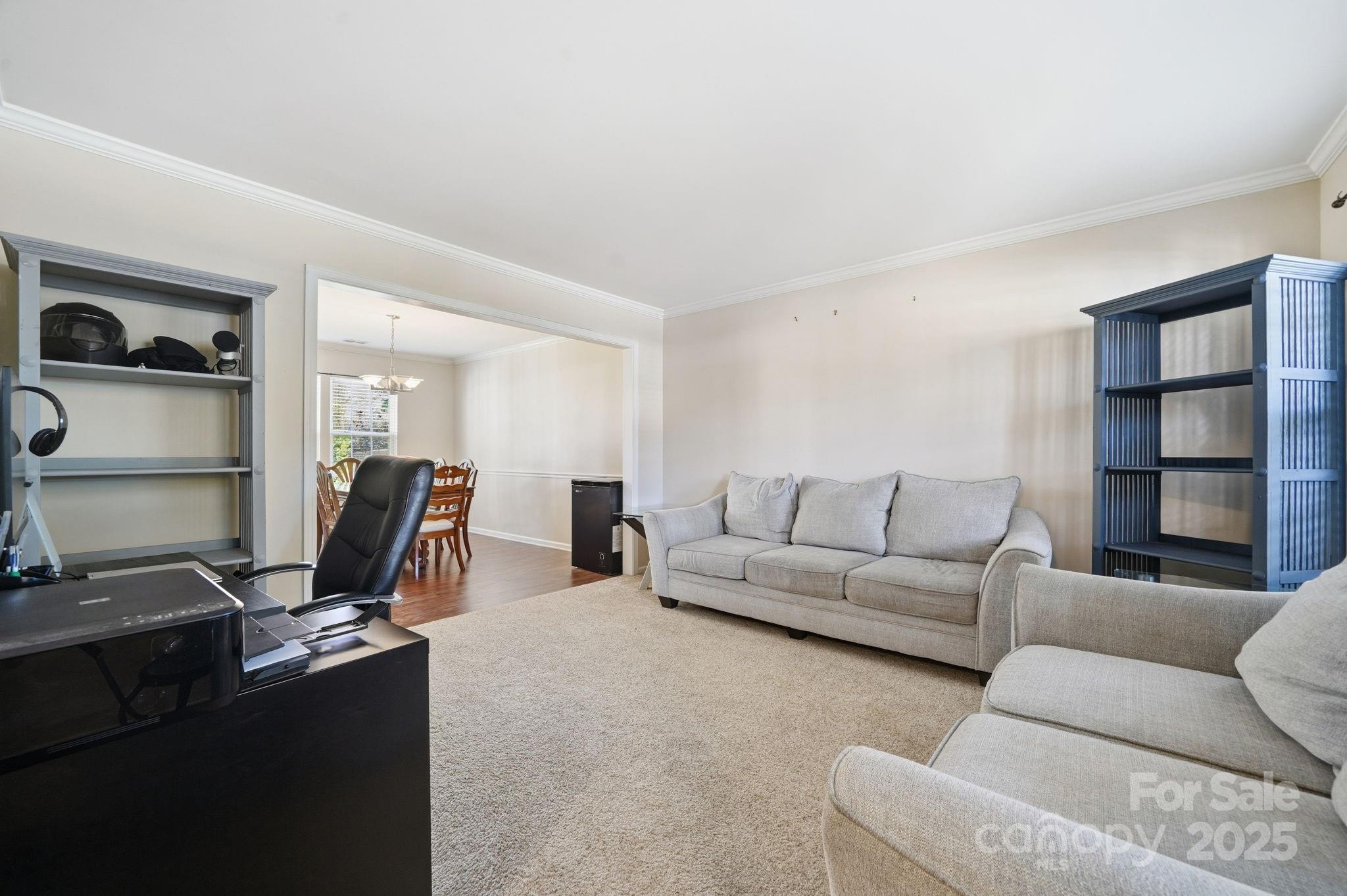 110 Nahcotta Drive Mooresville, NC 28115 - Photo 11 of 29 a living room with furniture gym equipment and a flat screen tv