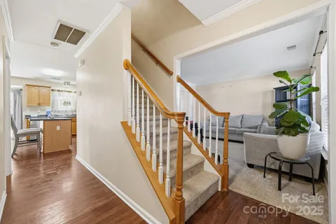 a view of entryway dining room and hall with wooden floor