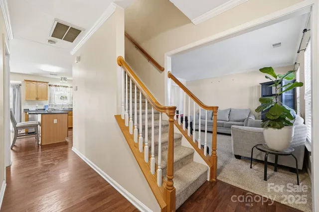a view of entryway dining room and hall with wooden floor