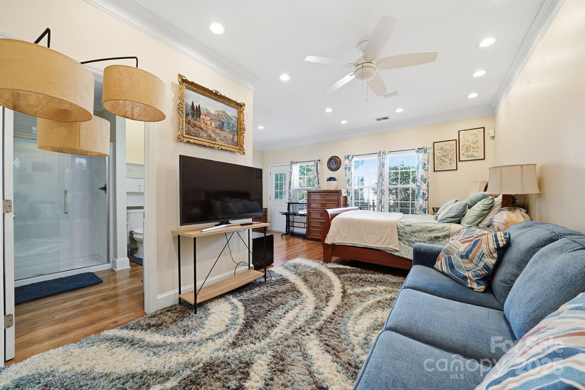 110 Nahcotta Drive Mooresville, NC 28115 - Photo 13 of 29 a living room with furniture and a flat screen tv
