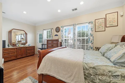 a bedroom with a large bed and a large window