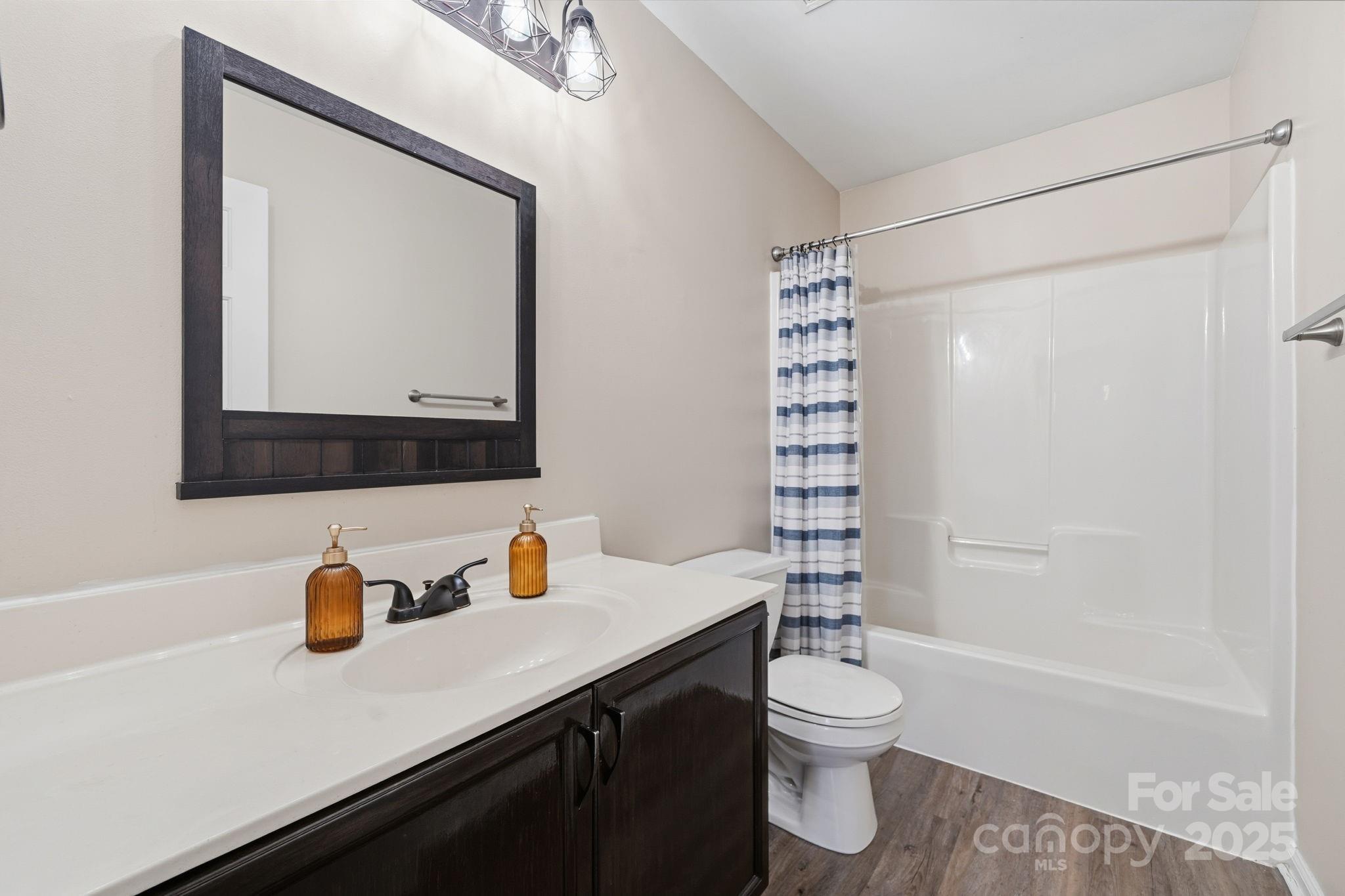 110 Nahcotta Drive Mooresville, NC 28115 - Photo 24 of 29 a bathroom with a sink a toilet and shower
