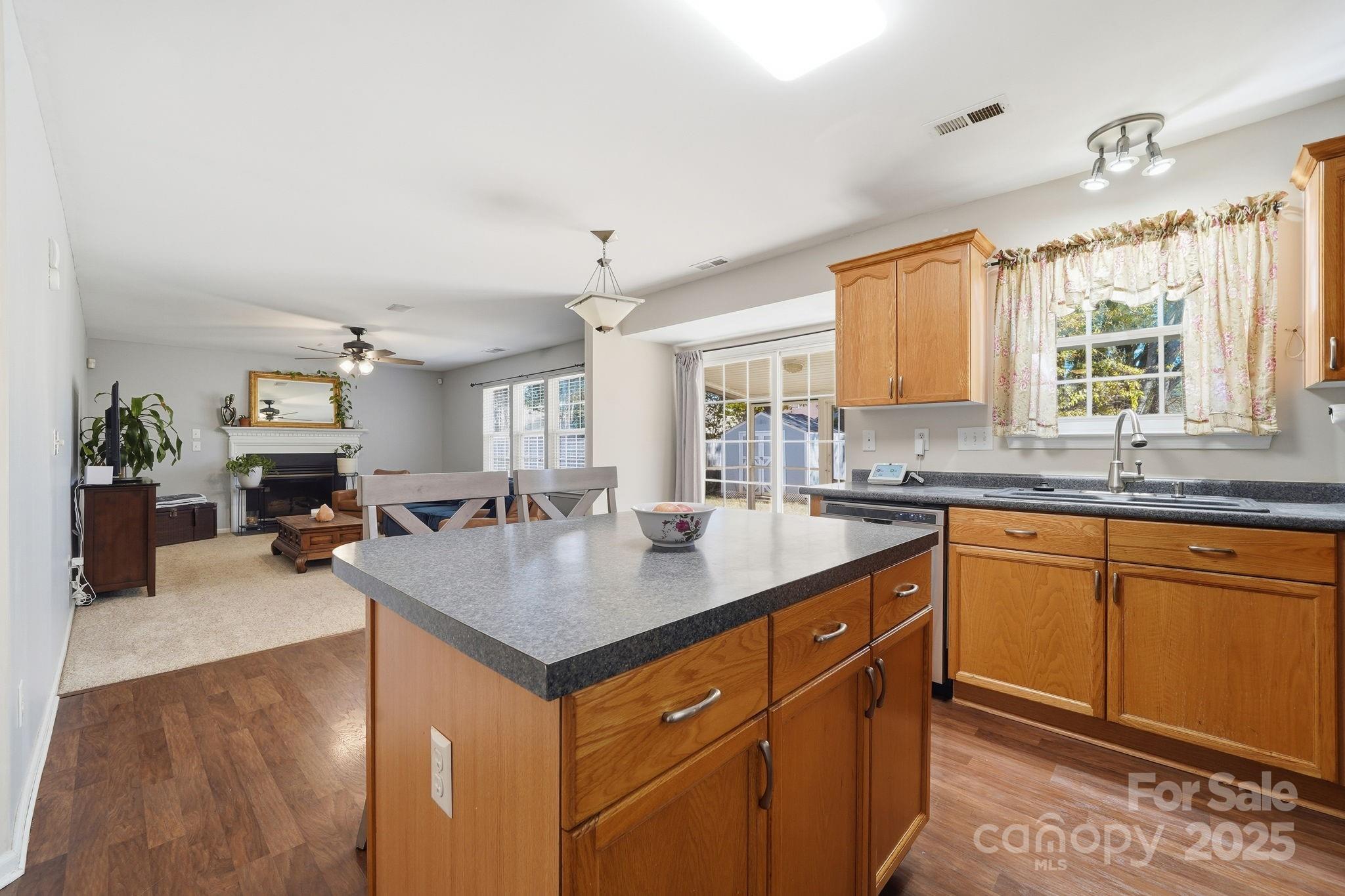 110 Nahcotta Drive Mooresville, NC 28115 - Photo 4 of 29 a kitchen with sink cabinets and living room