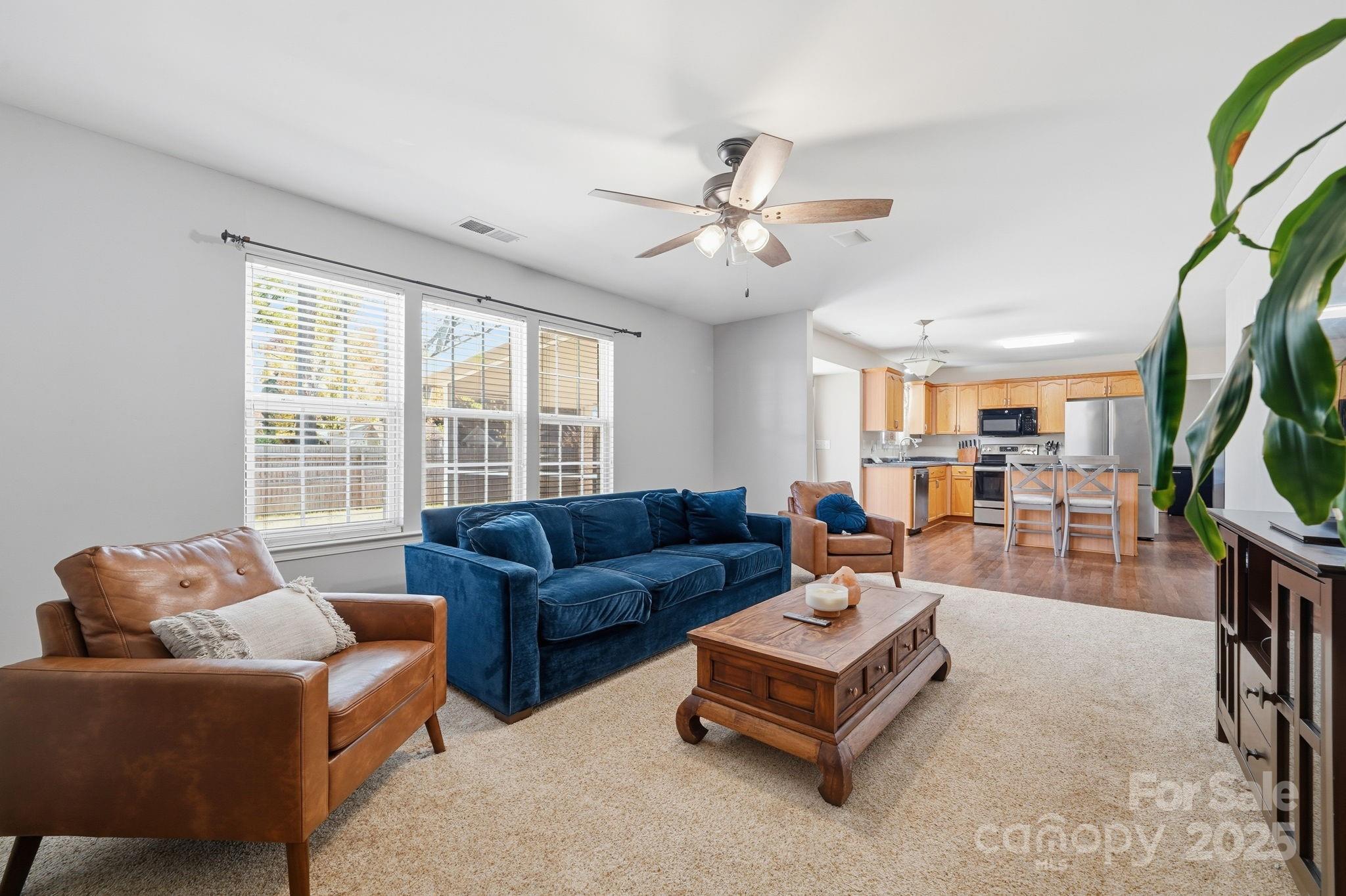 110 Nahcotta Drive Mooresville, NC 28115 - Photo 6 of 29 a living room with furniture and a large window