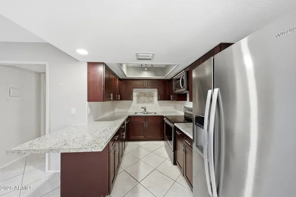 a kitchen with a stove and a microwave